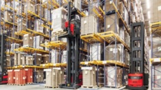 A Linde very narrow aisle truck in a high rack warehouse.